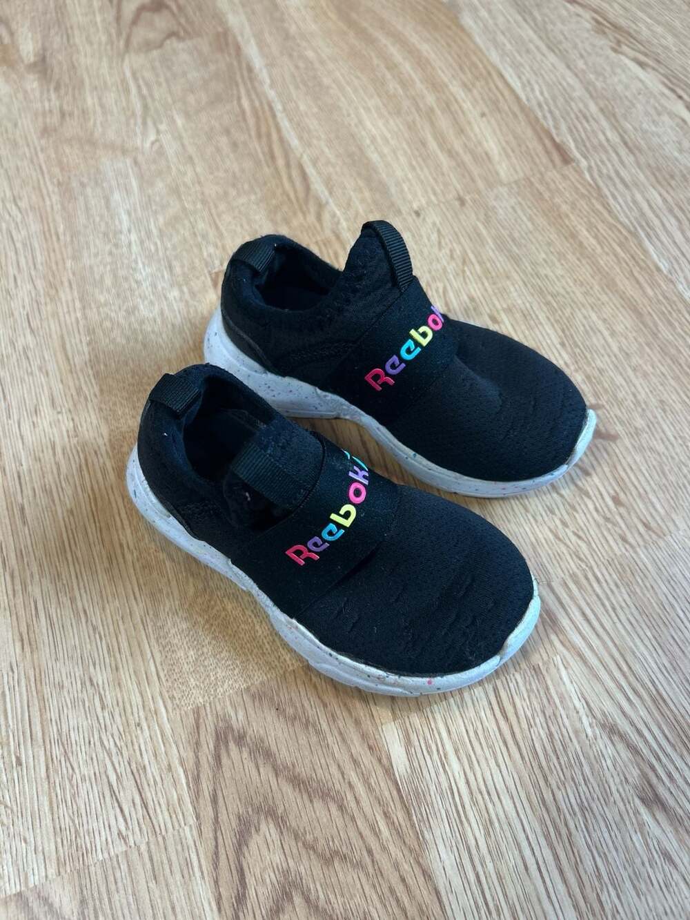 Reebok Toddler Girls Black Slip-On Sneakers with Rainbow Speckle Sole
